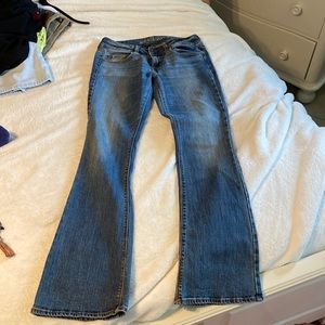 - Low rise  - medium/dark denim - boot cut/flare                - double buttons